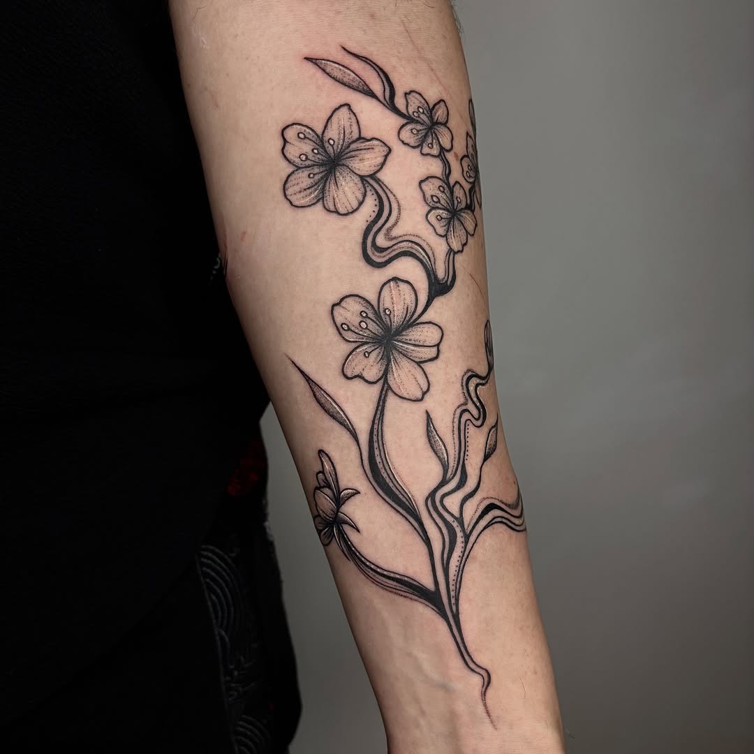 Graceful blackwork floral vine with five-petal blossoms
