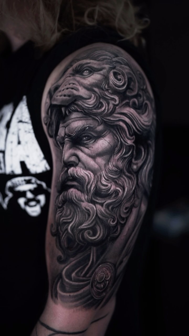 Dramatic black-and-gray mythic bust with flowing mane