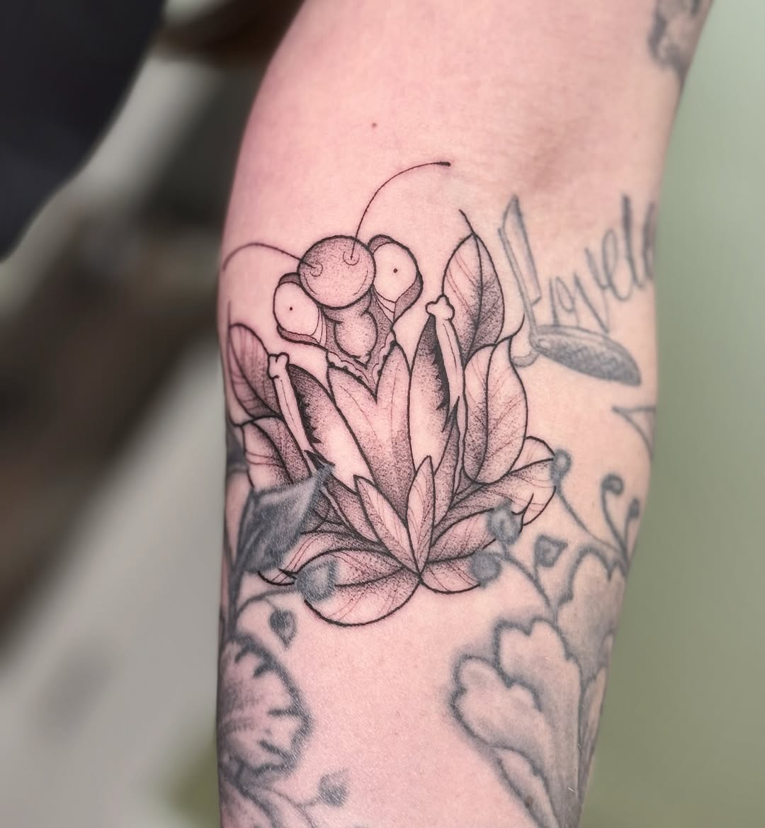 Delicate blackwork lotus bloom with fine-line shading