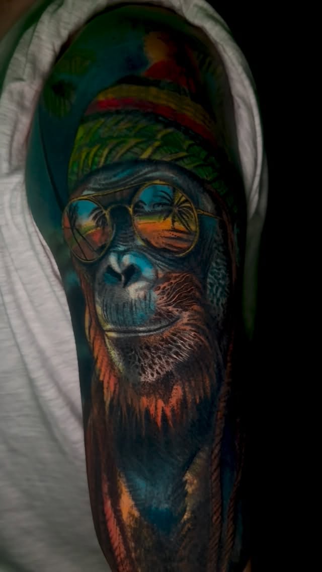 Vibrant Rastafari monkey portrait with tropical sunset reflections