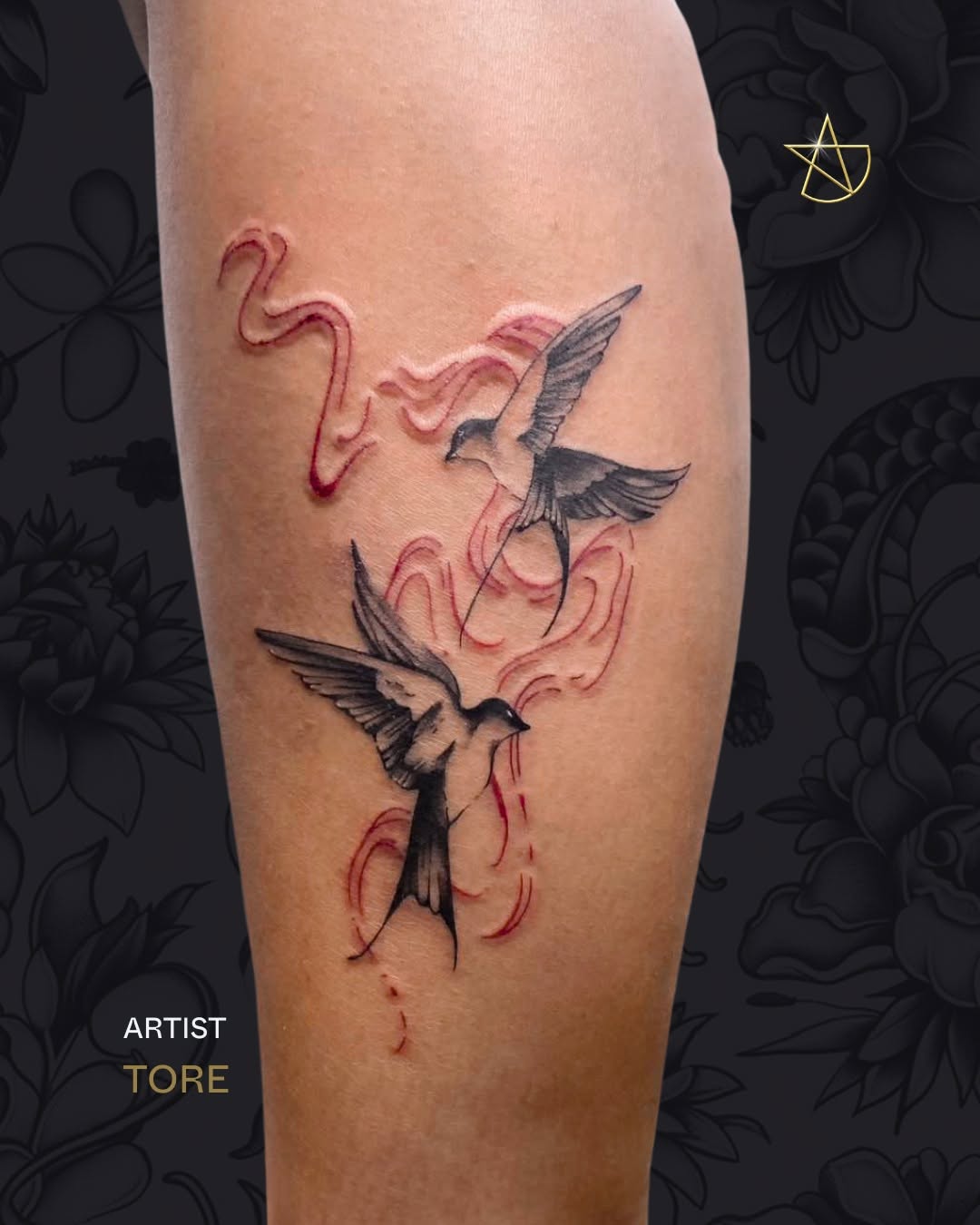 Dynamic swallow duo in bold blackwork with red accents