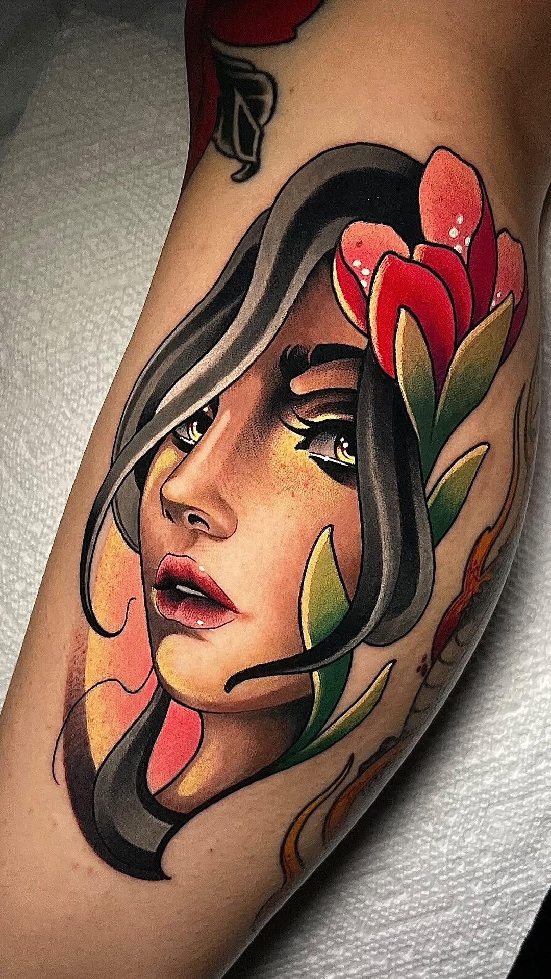 Vibrant neo-traditional female portrait with bold red florals