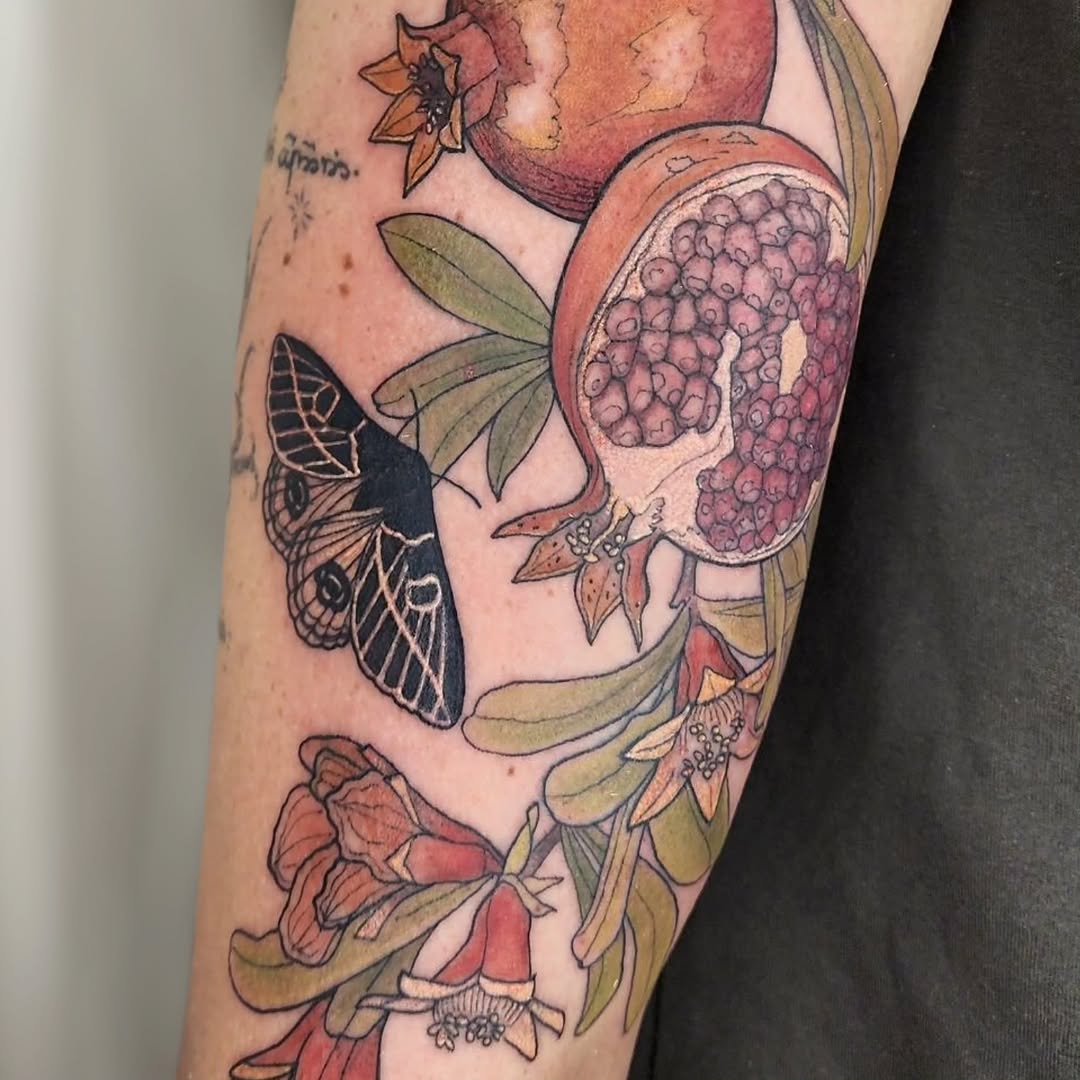 Bold neo-traditional pomegranate with butterfly and florals