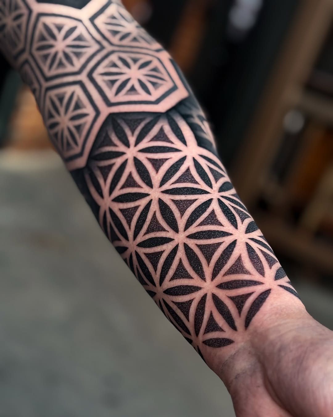 Intricate sacred-geometry sleeve pattern with interlocking petals