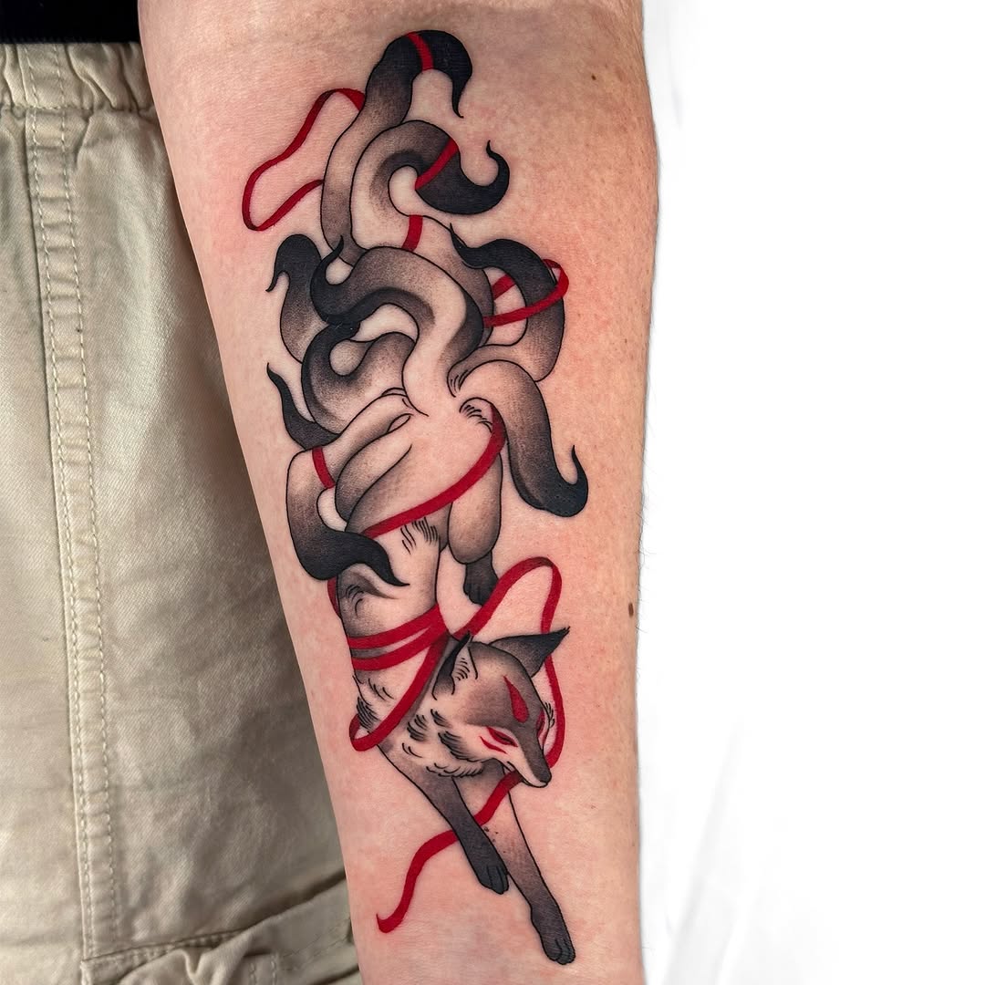 Stylized fox entwined with crimson ribbons and smoke