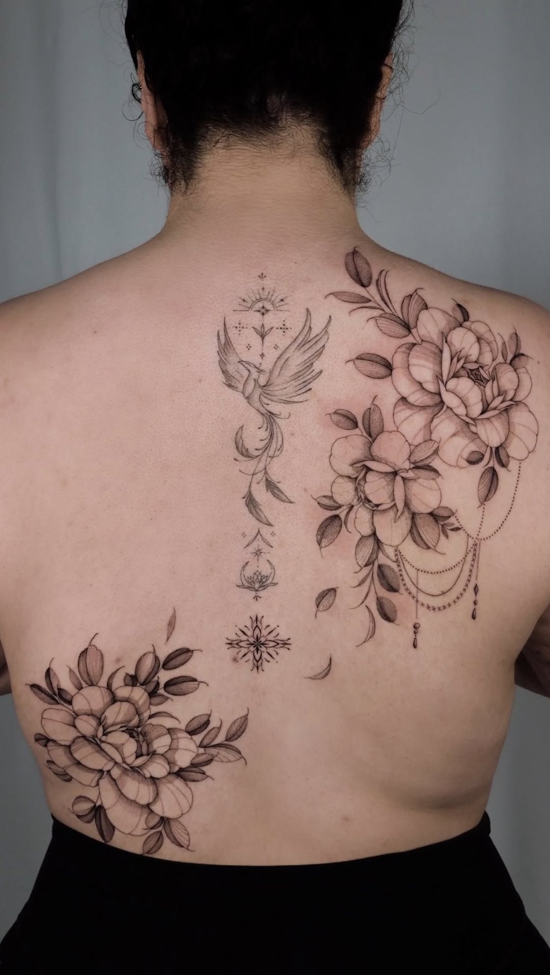 Delicate linework floral back piece with peonies and phoenix