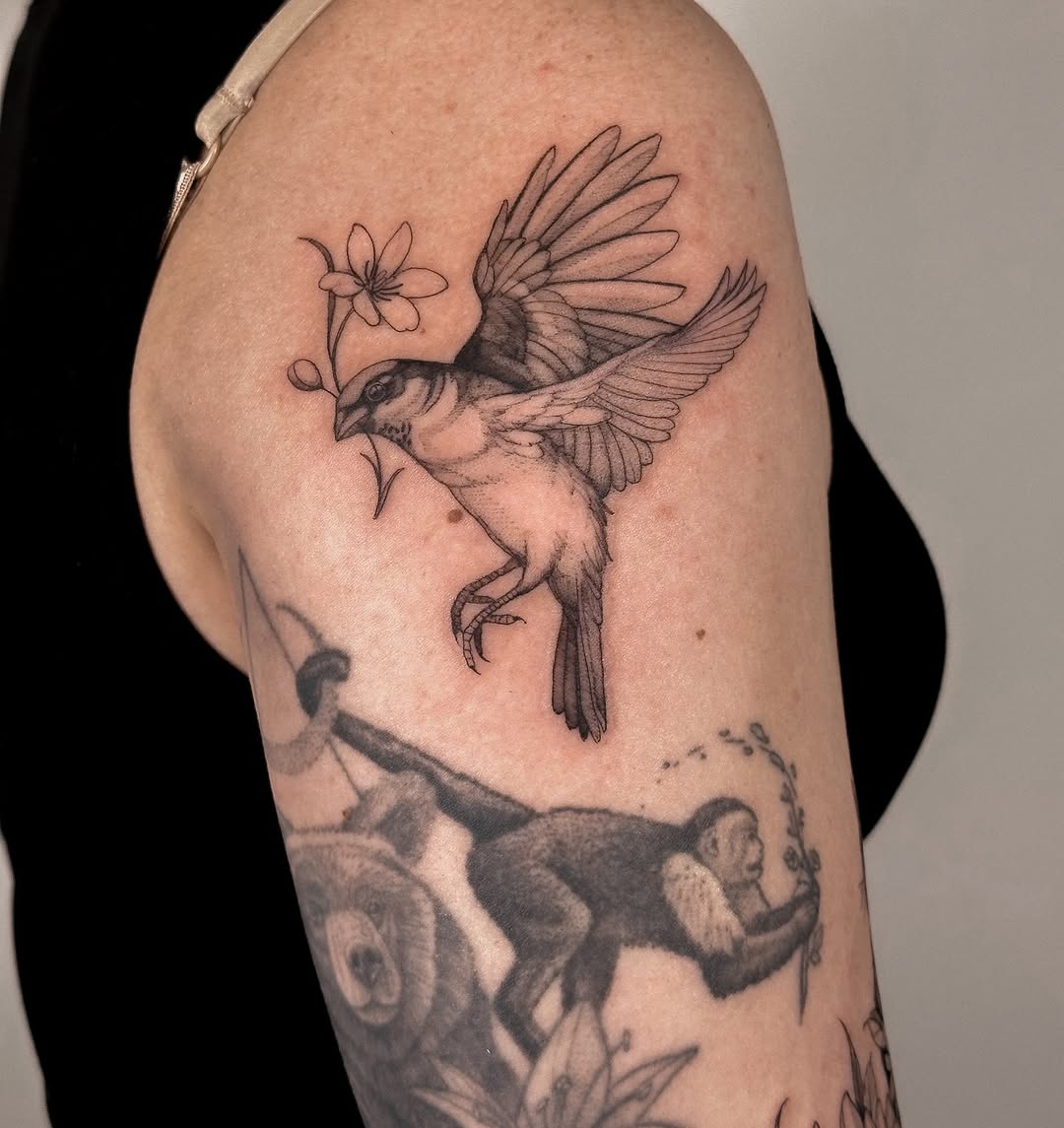 Delicate fine-line bird in flight with blossom