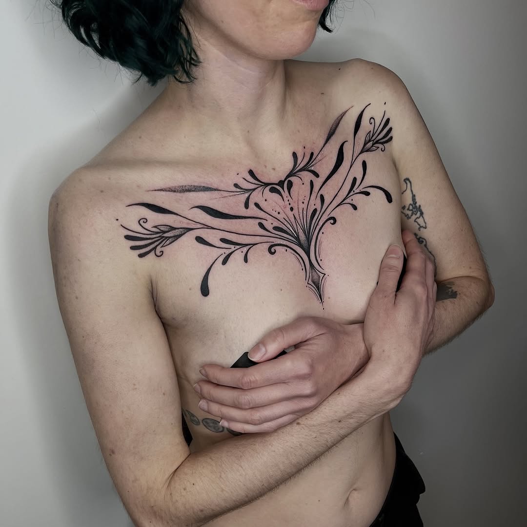 Bold black floral spread across the chest with elegant curves