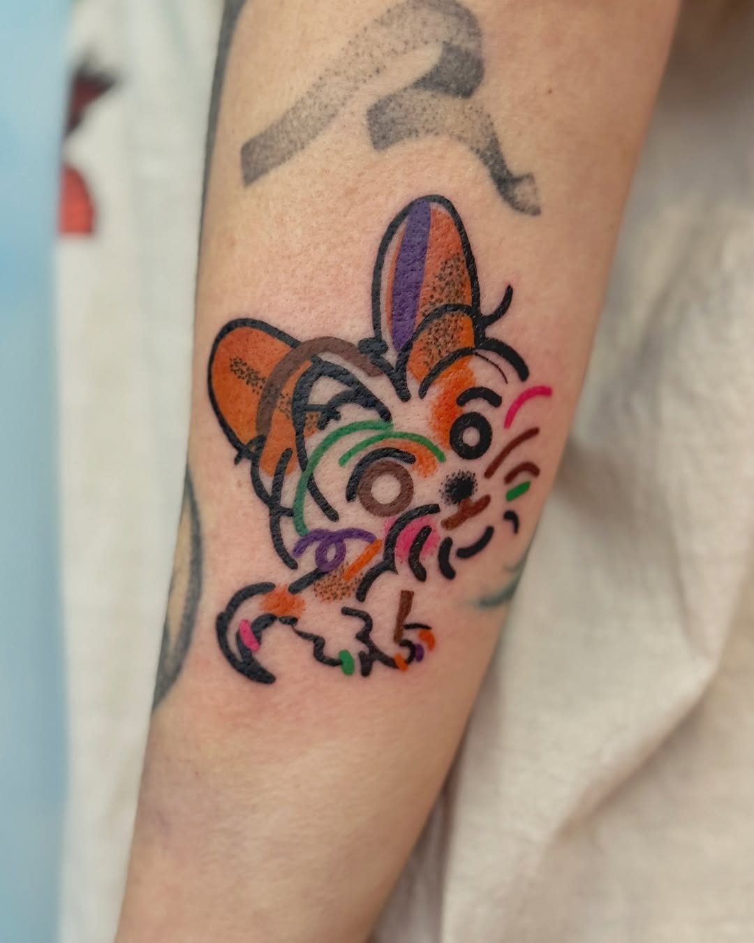 Playful cartoon dog with rainbow squiggles and bold outlines.