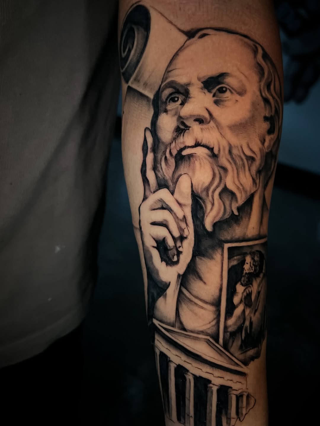 Stoic Socrates-inspired bust with dramatic black-gray shading.