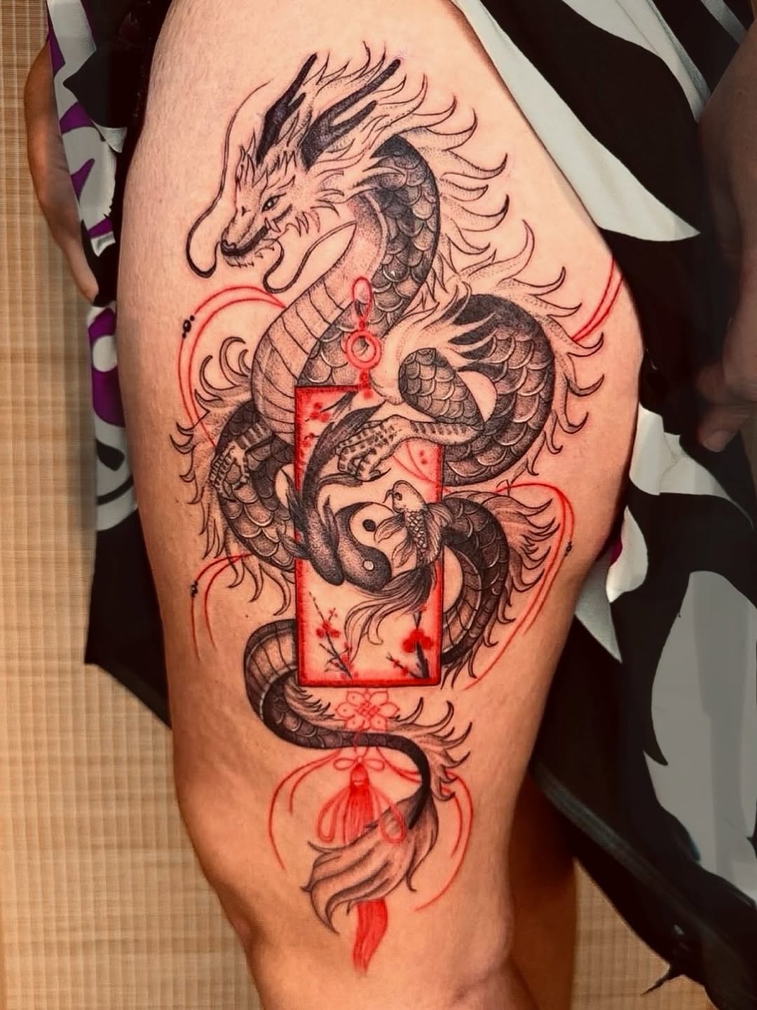 Bold Japanese dragon wrapped around crimson frame.