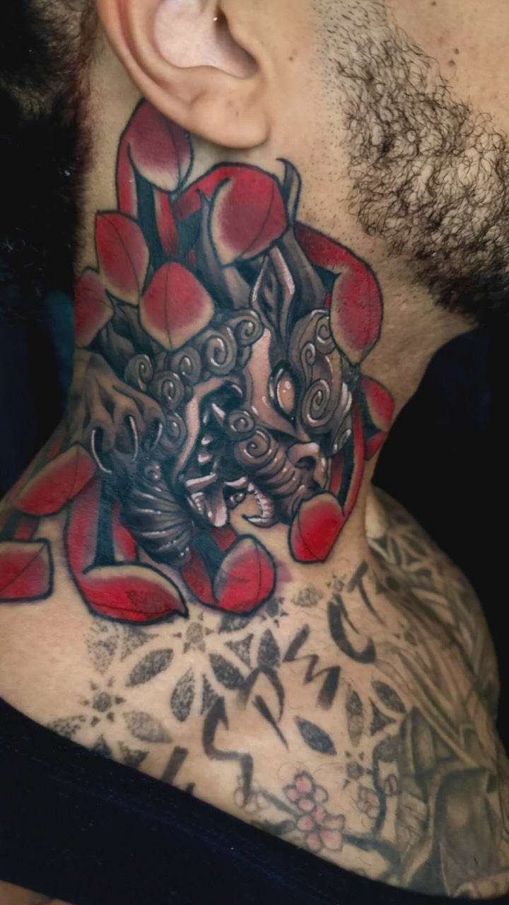 Japanese dragon with swirling clouds among red cherry blossoms