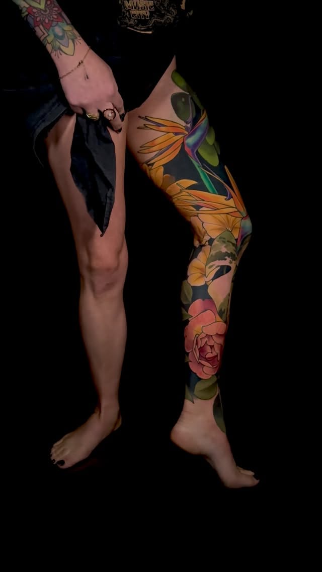 Vibrant floral leg sleeve with bold color and shading