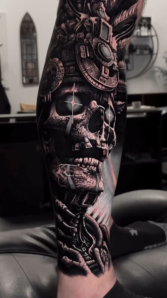 Intricate Aztec skull biomechanical leg sleeve in progress