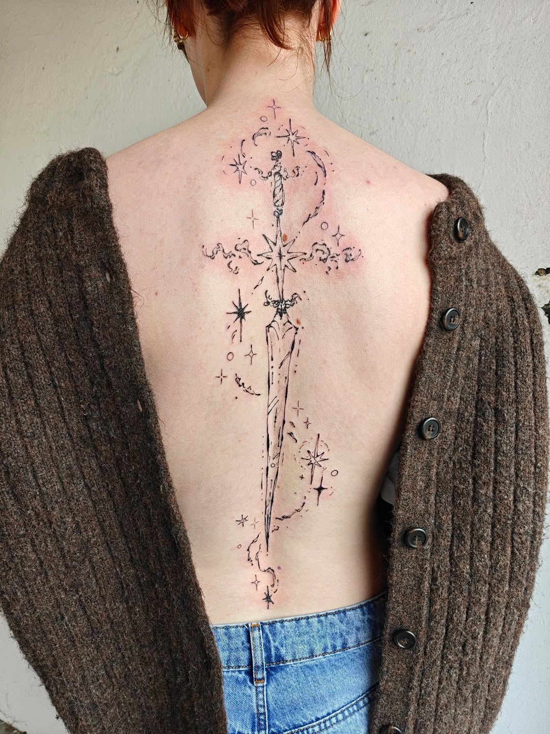 Delicate back sword with celestial stars and fine-line sparkles