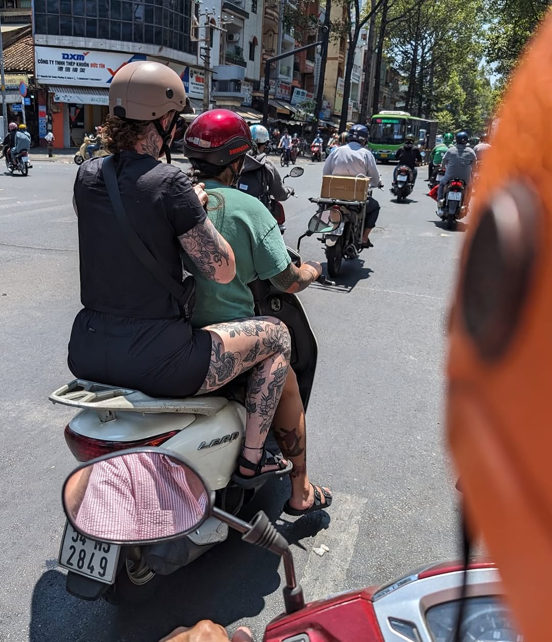 Bold black-and-gray floral sleeves with twisting vines