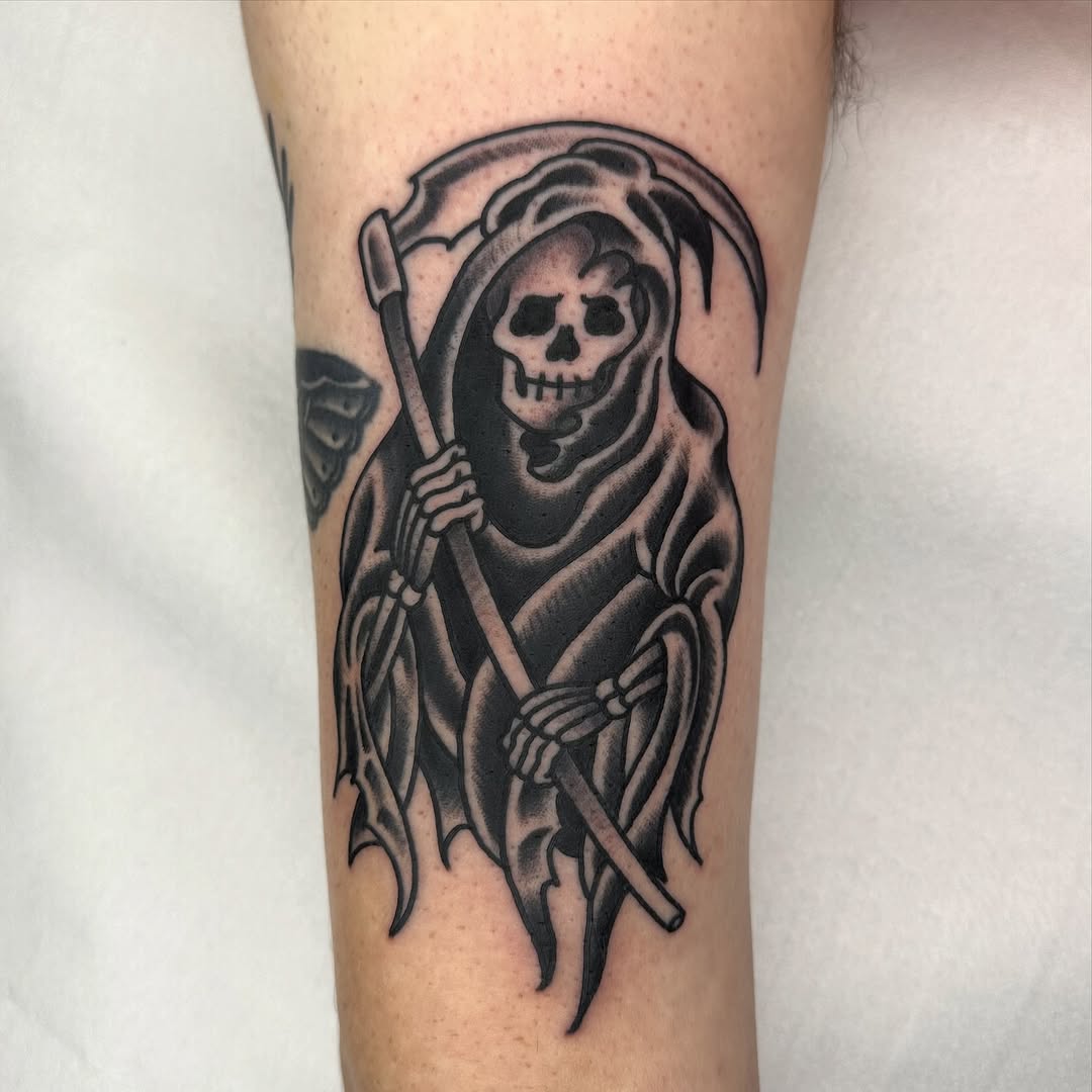 Bold neo-traditional Grim Reaper with a scythe, high-contrast shading