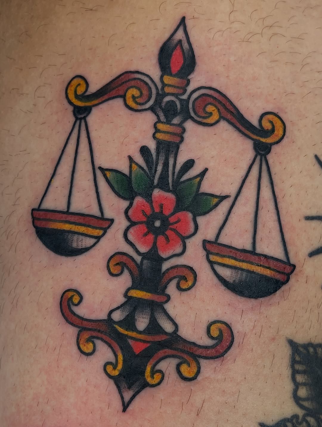 Bold neo-traditional scales with blooming central fleur-de-lis