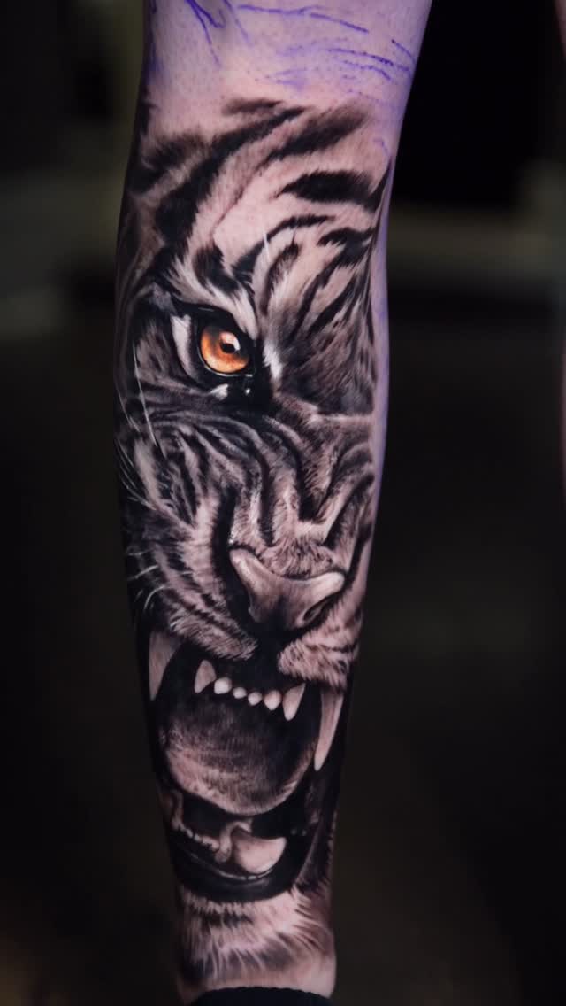 Hyper-realistic grayscale tiger portrait with piercing orange eye