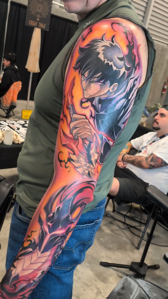 Vibrant manga-inspired sleeve with fiery energy and flame motifs