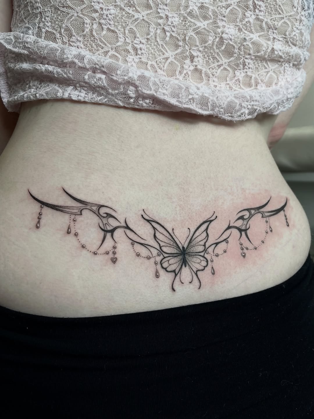 Delicate butterfly centerpiece with ornamental bead drapes.