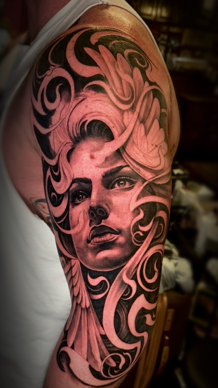 Dramatic black-and-gray Valkyrie portrait with ornate curls.