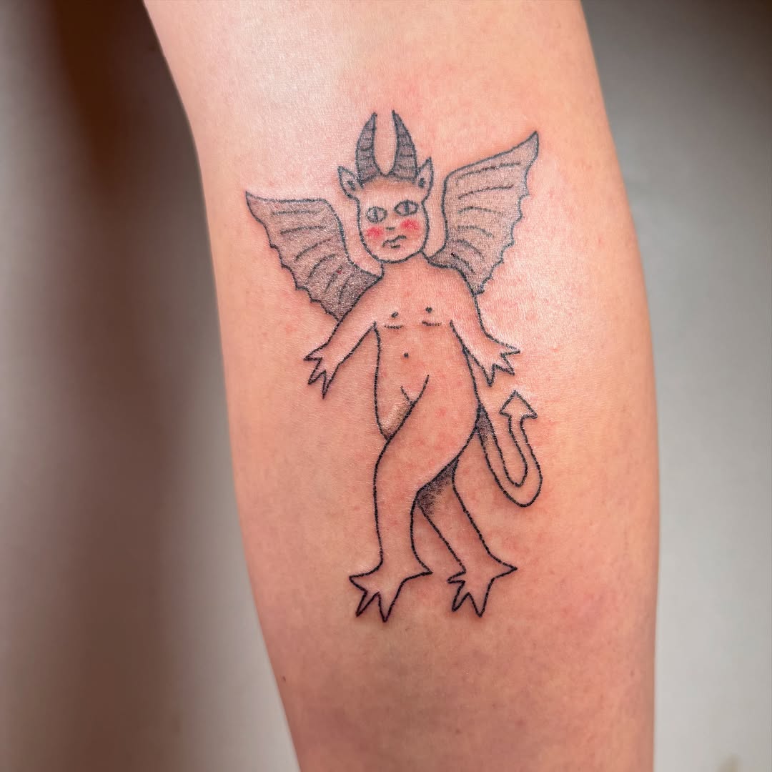 Devil tattoo on leg