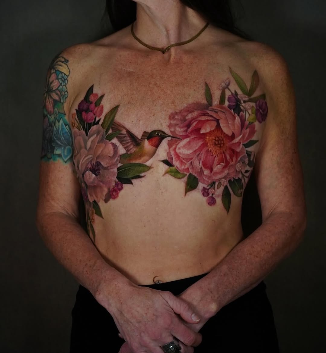 Vibrant floral chest piece with hummingbird centerpiece