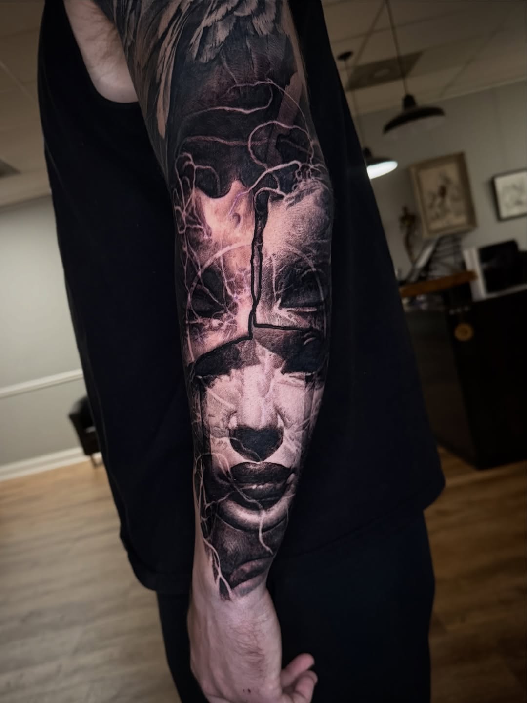 Striking black-and-gray portrait sleeve with abstract linework