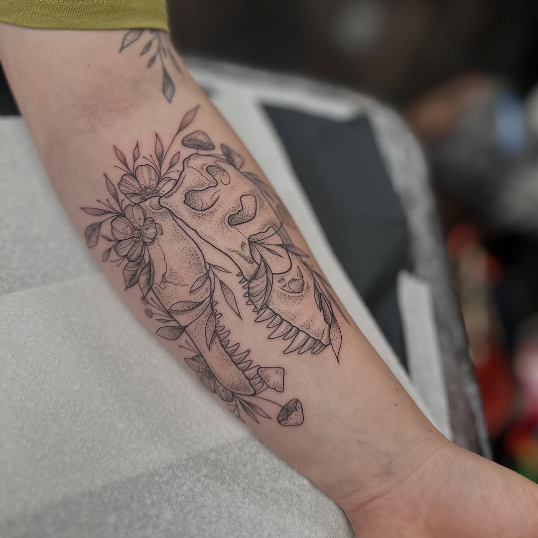Bold T rex skull with delicate botanical dotwork