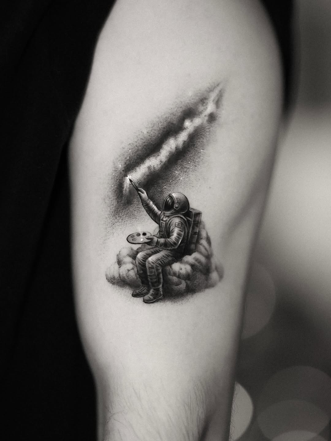 Astronaut painter perched on clouds, bold stippled black-and-gray ink