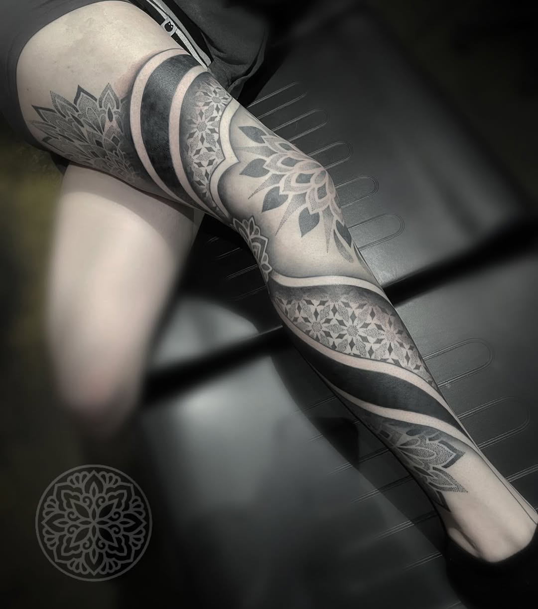 Ornamental geometric leg sleeve with bold blackwork mandalas