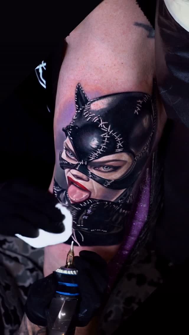 Hyper-realistic Catwoman portrait on forearm with stitched latex