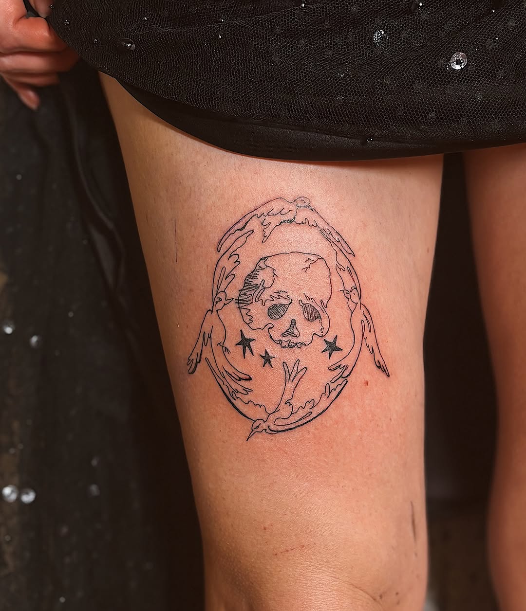 Skull surrounded by leaves