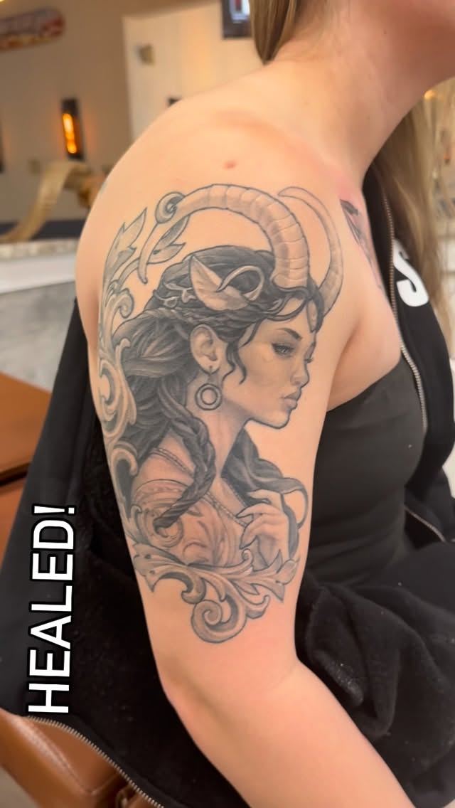 Healed tattoo of a woman
