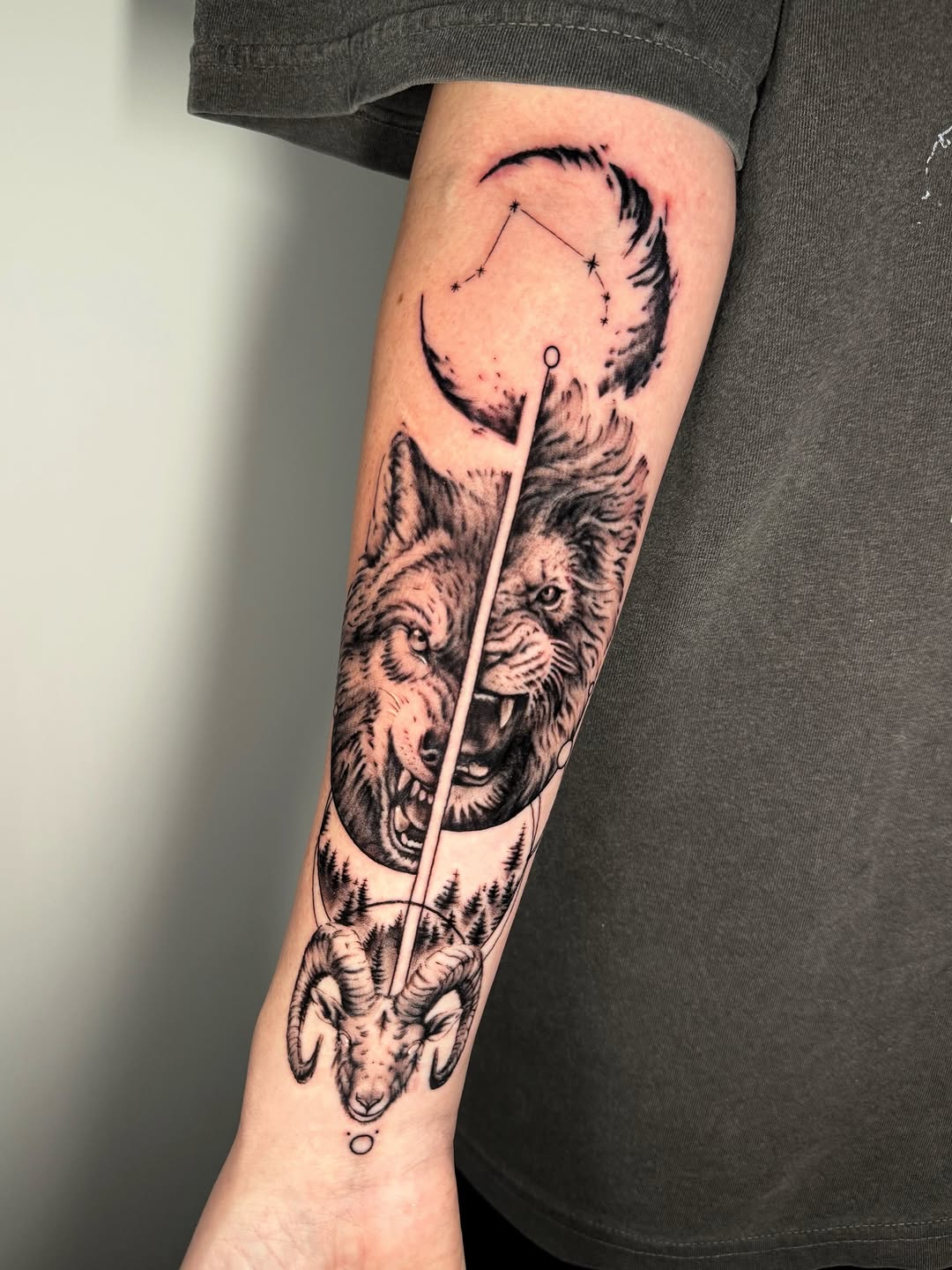 Dramatic dual-wolf blackwork with moon, stars, and ram skull