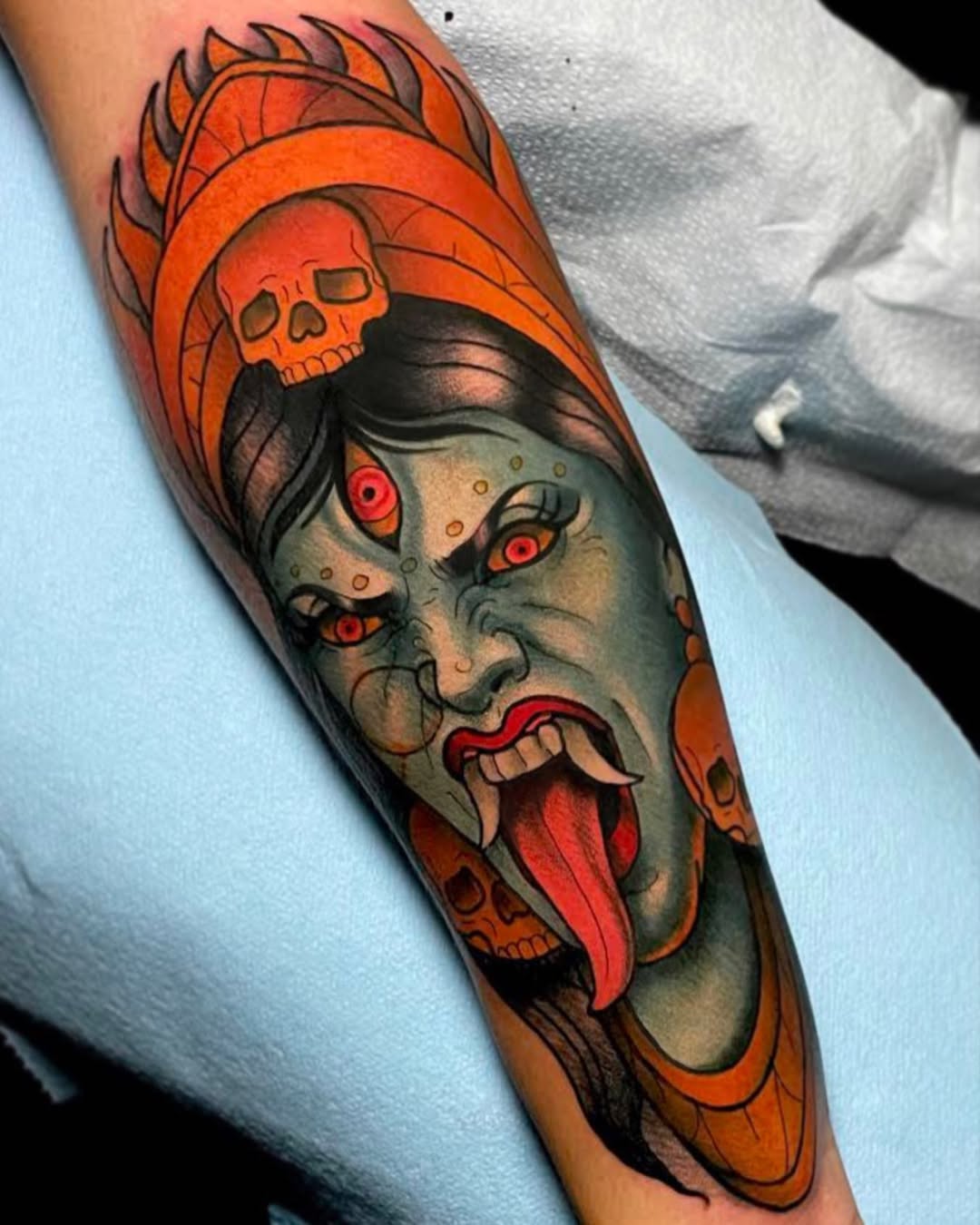 Vibrant neo-traditional Kali portrait with orange halo