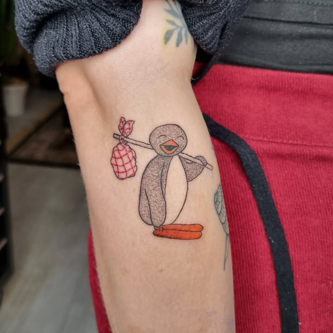 Whimsical penguin carrying a stick with red sack