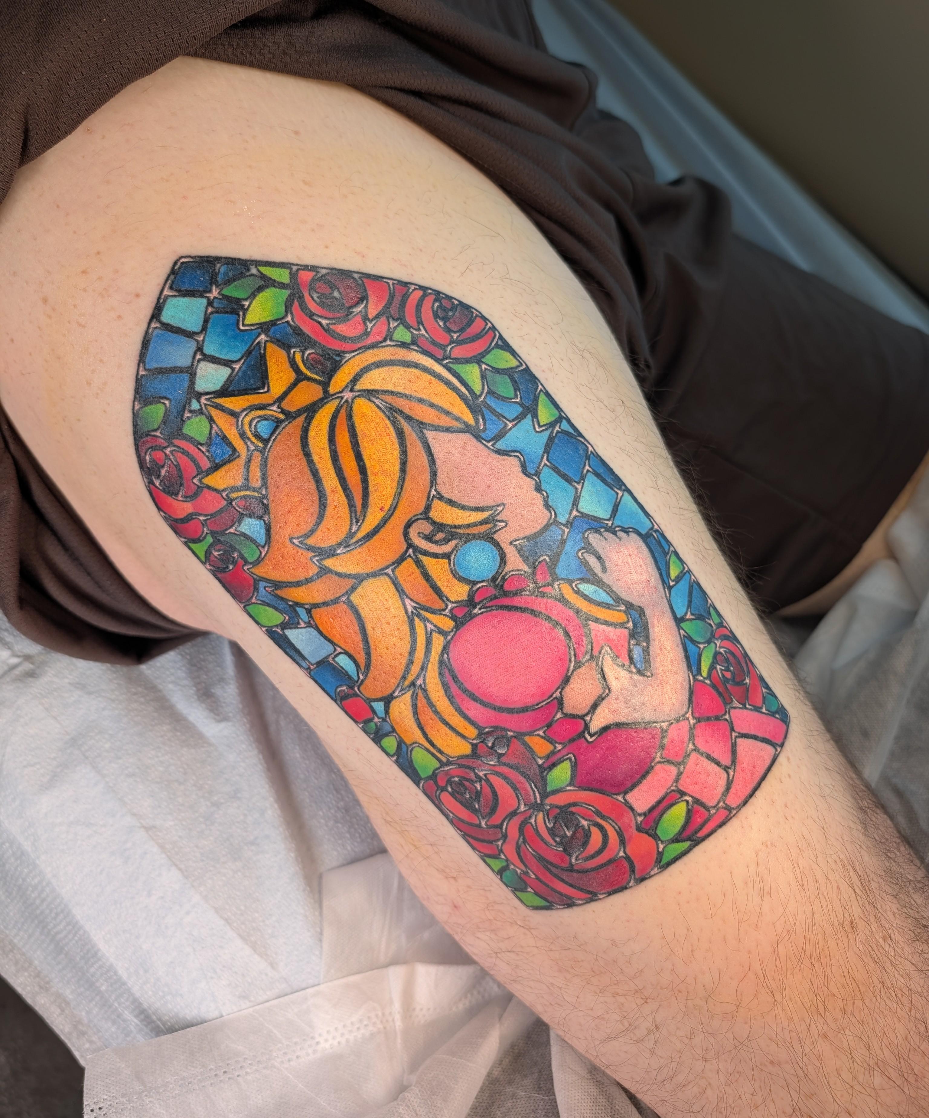 Vibrant stained-glass Princess Peach portrait on outer thigh