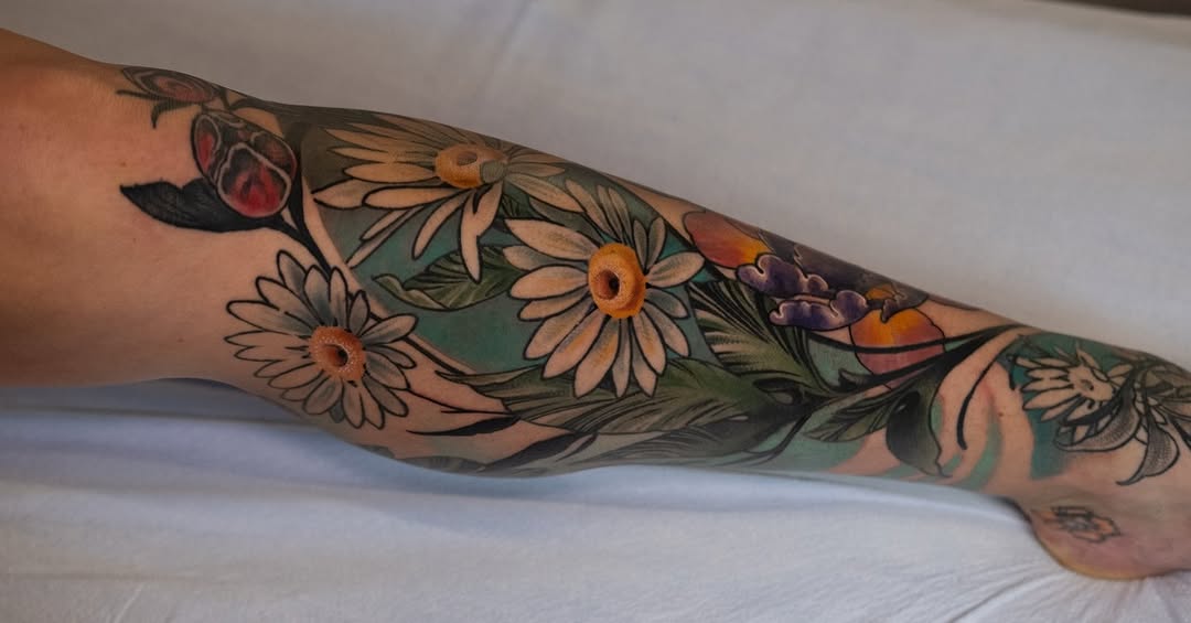 Vibrant floral leg sleeve with white daisies, bold outlines