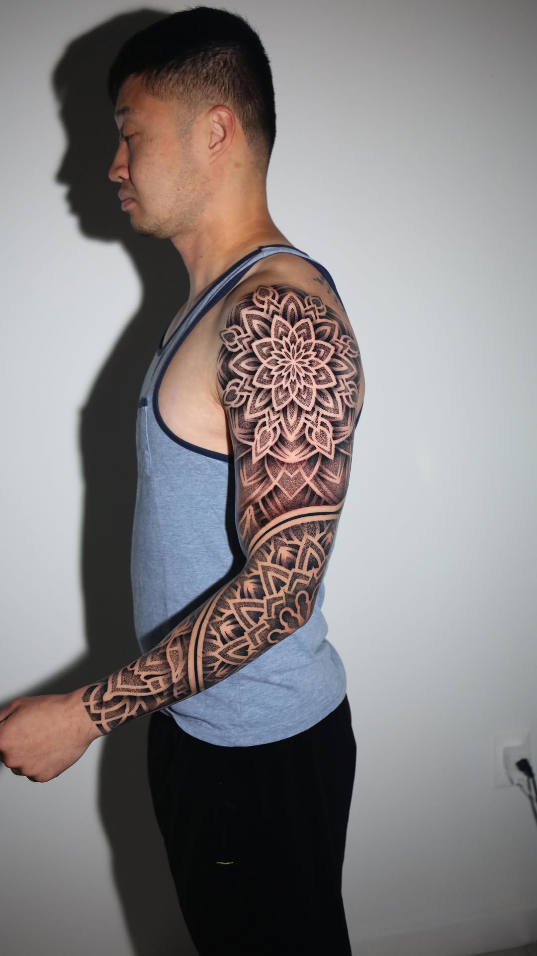 Intricate blackwork mandala sleeve with bold dot shading