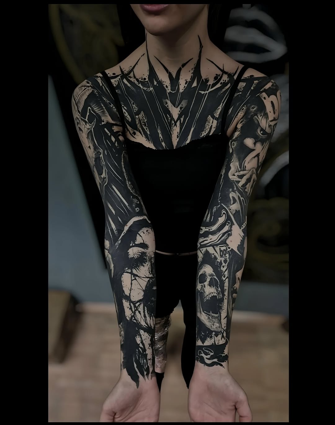 Macabre blackwork full-sleeves with skulls and chaos