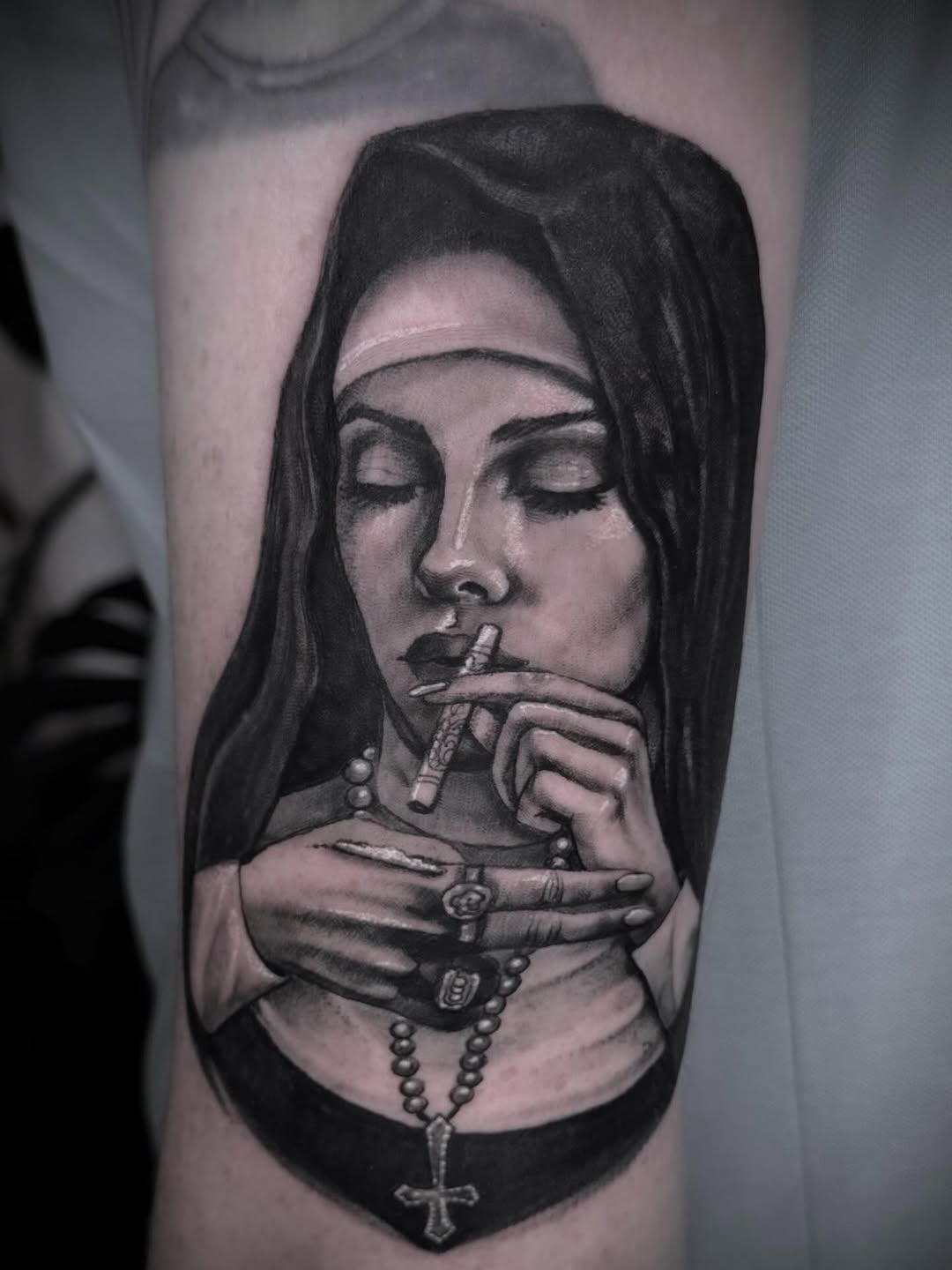 Monochrome nun portrait, cigarette in hand, rosary beads