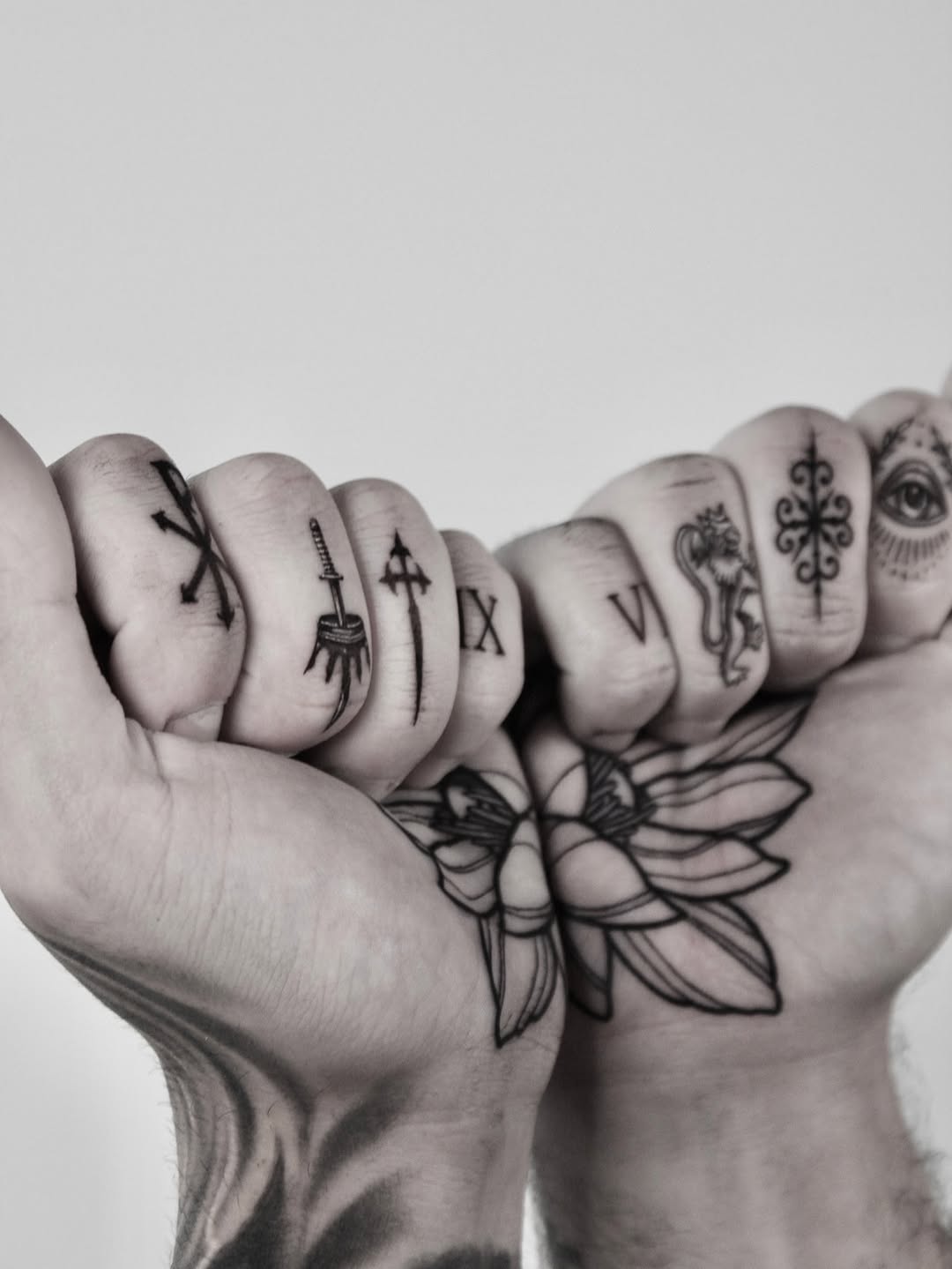 Crisp fingertip glyphs paired with a bold floral back-of-hand