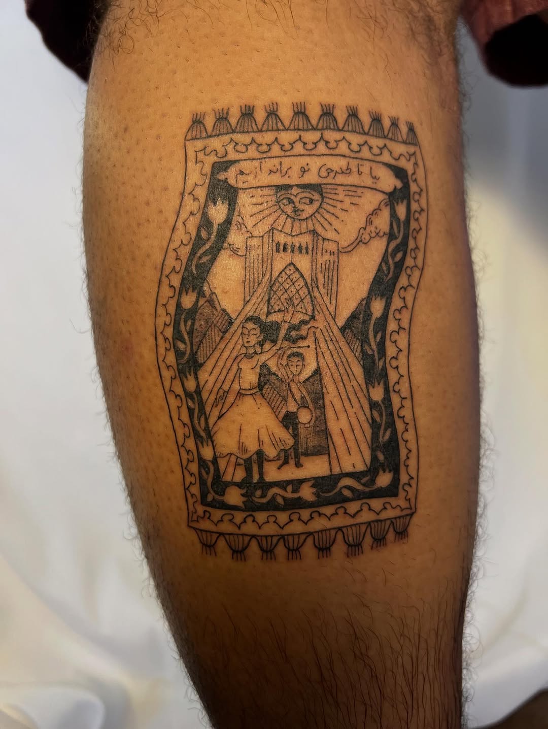 Ornate framed blackwork scene with sun and dancing couple