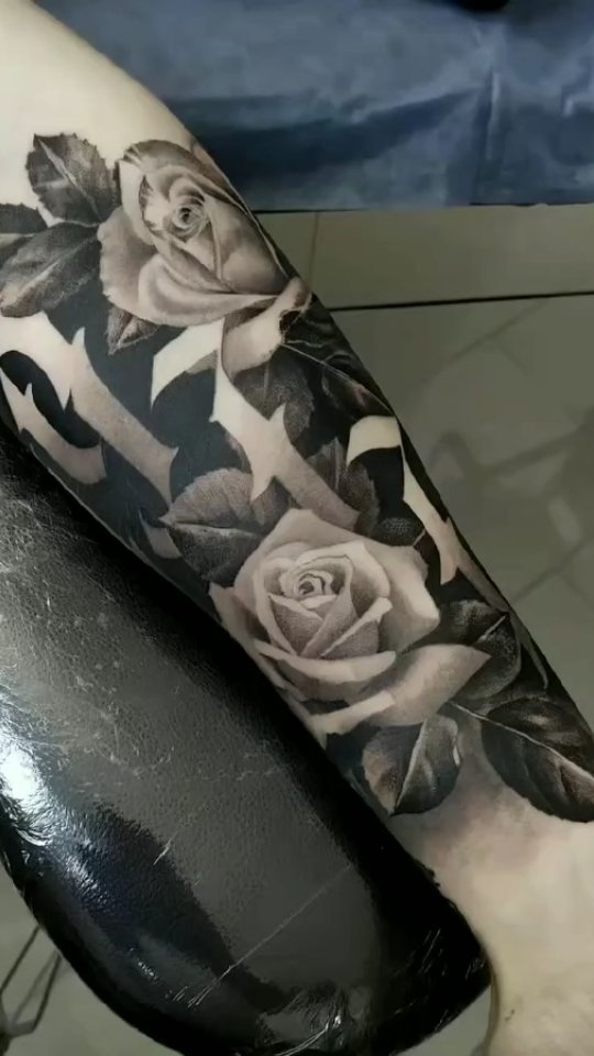 Monochrome rose sleeve with lush shading and leaves