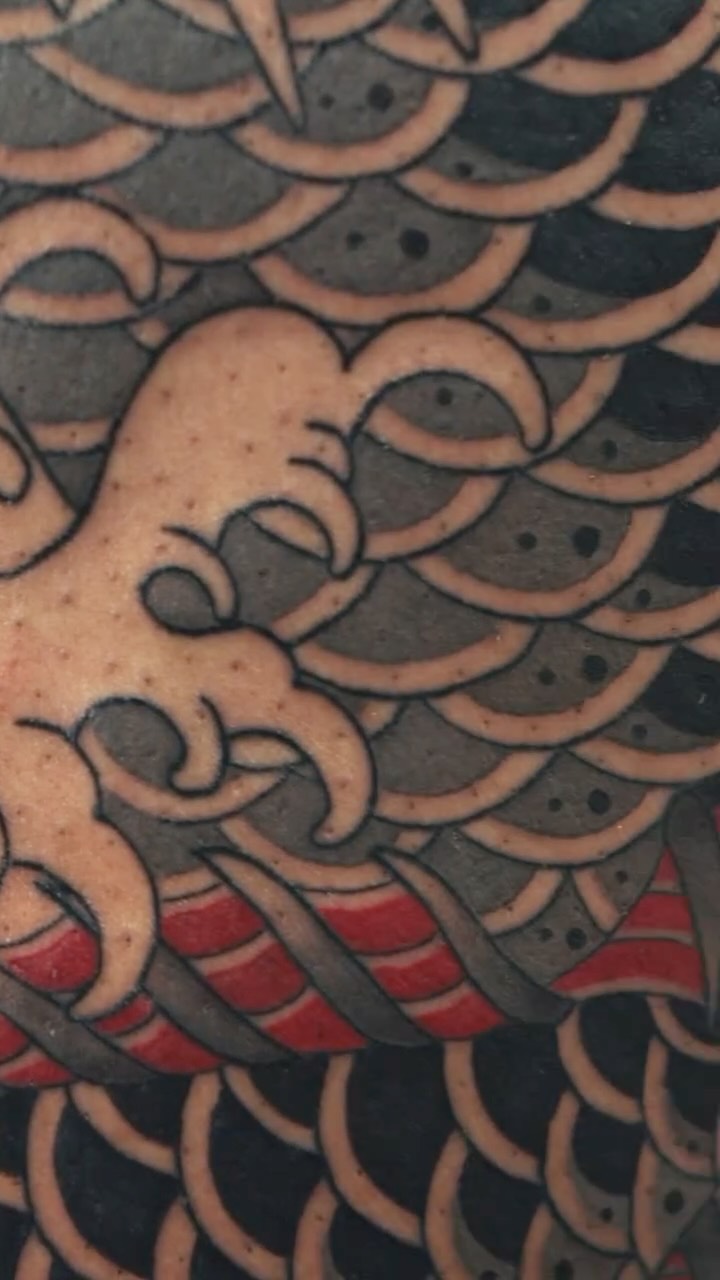 Bold Japanese koi-scale pattern in solid black outlines.