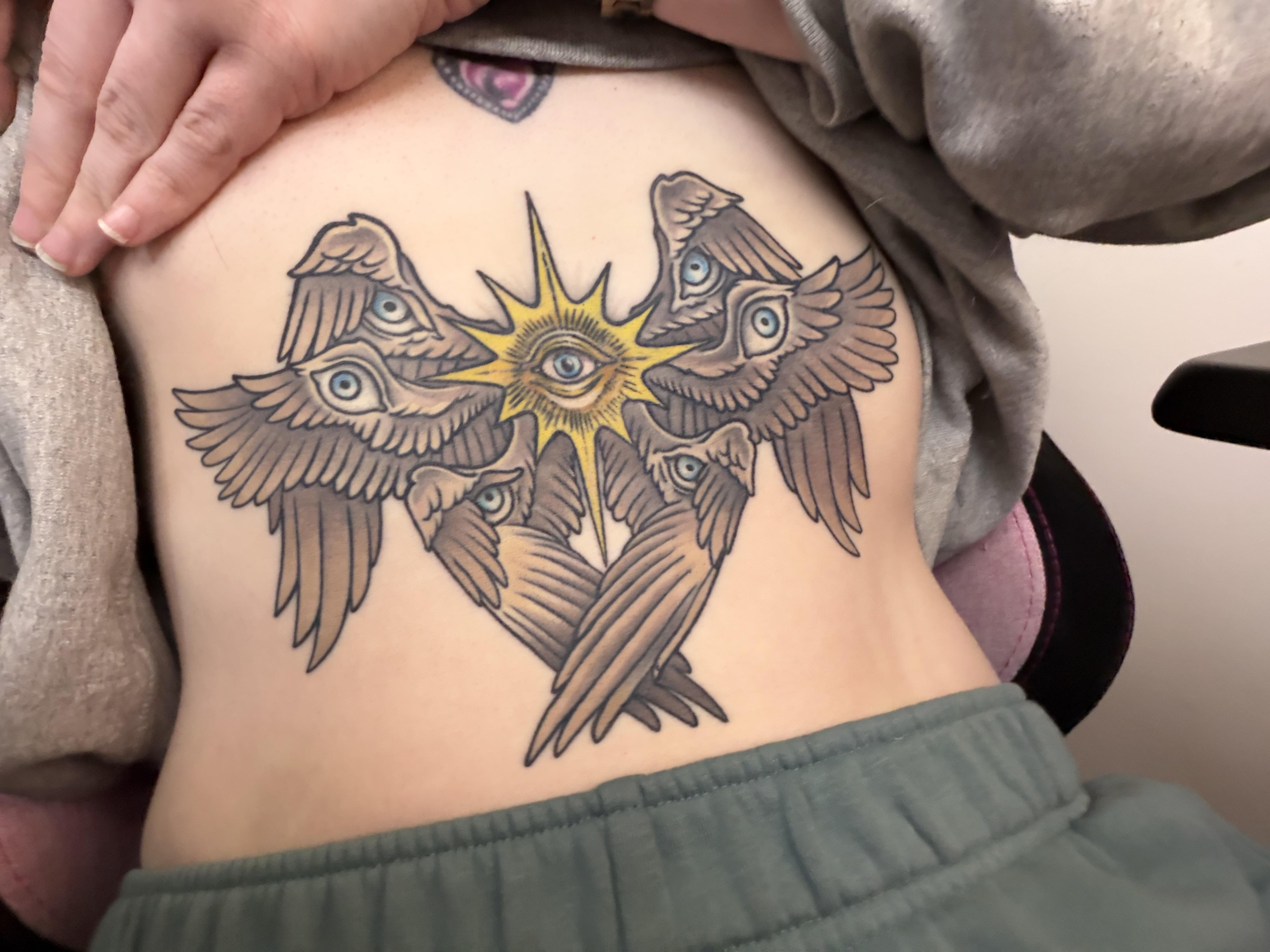 Seraphim-inspired sun with six winged birds.
