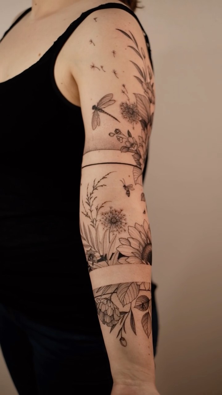 Intricate botanical sleeve with sunflowers, dandelion seeds, dragonfly