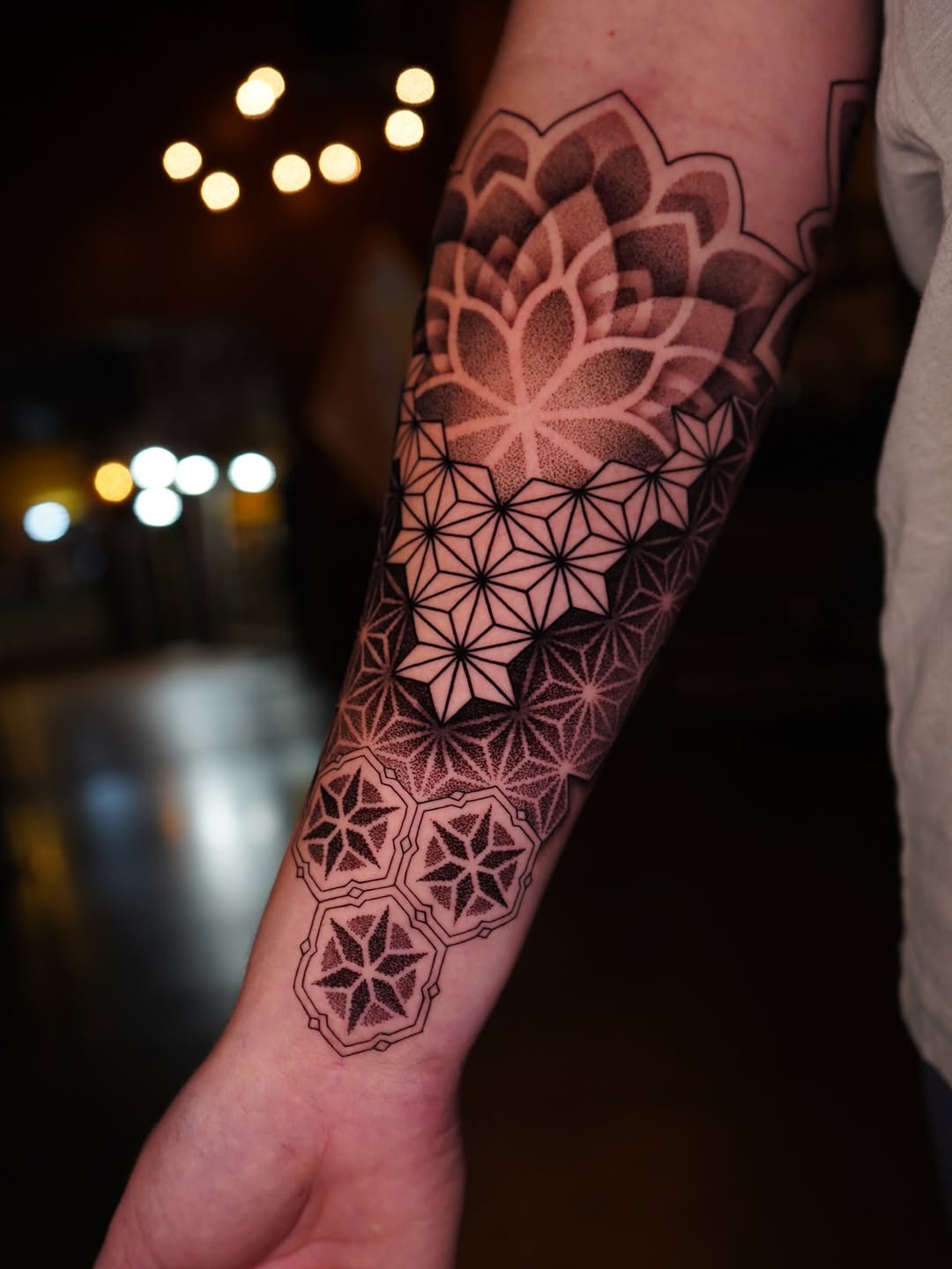 Mandala lotus with geometric tessellation, bold linework and dot shading